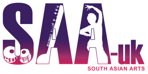 The South Asian Arts UK logo. The logo is purple and pink, reading SAA-UK in large letters, with cut outs of classical indian instruments and a classical Indian dancer. Underneath are the words South Asian Arts in smaller lettering.
